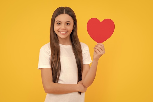 Smiling kid hold love on yellow background valentines sale