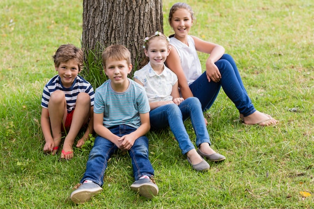 Smiling kids relaxing in park