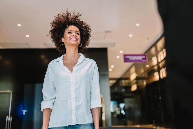 Smiling Latin businesswoman at hotel lobby