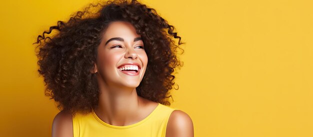 Smiling Latina woman with curly hair on a blank background