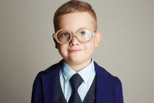 Smiling little boy in suit and tie