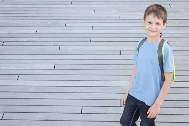 Smiling little boy with backpack