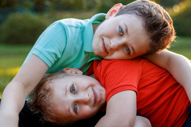 Smiling little boys playing in nature