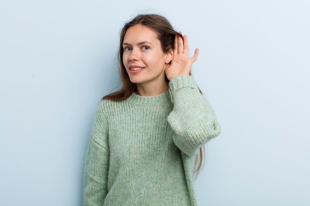 Photo smiling looking curiously to the side trying to listen to gossip or overhearing a secret