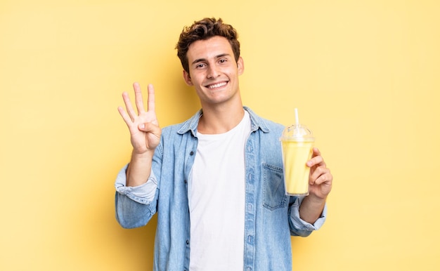 Smiling and looking friendly, showing number four or fourth with hand forward, counting down. milkshake concept