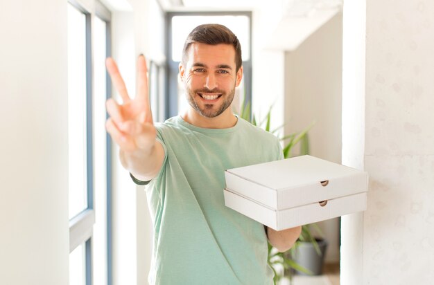 smiling and looking happy, carefree and positive, gesturing victory or peace with one hand