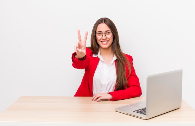 Smiling and looking happy gesturing victory or peace