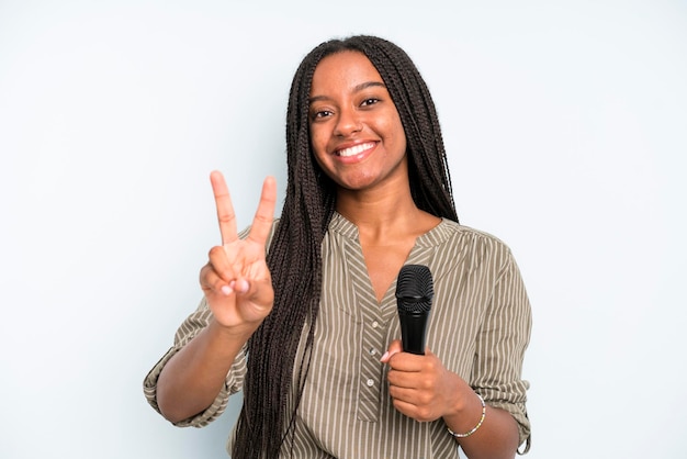 Smiling and looking happy gesturing victory or peace