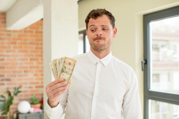 smiling and looking with a happy confident expression dollar banknotes concept