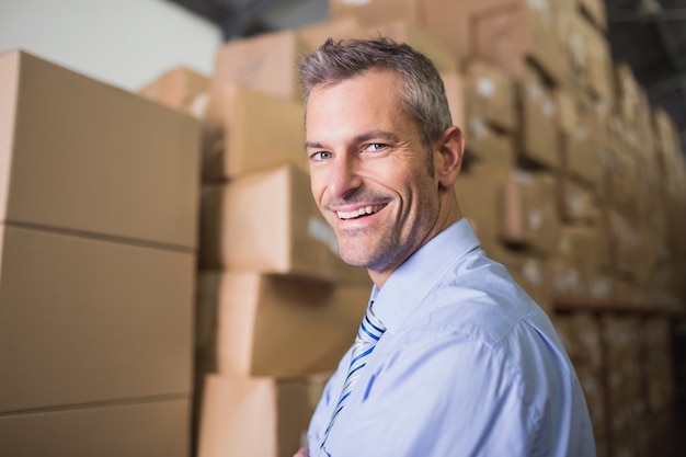 Smiling male manager in warehouse