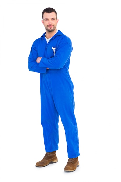 Smiling male mechanic holding spanner