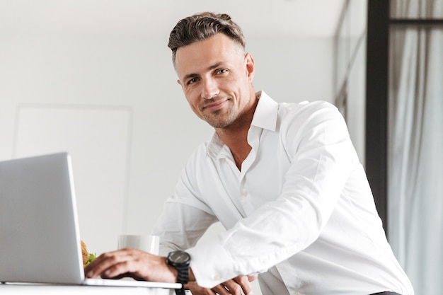 Smiling man dressed in formal clothes