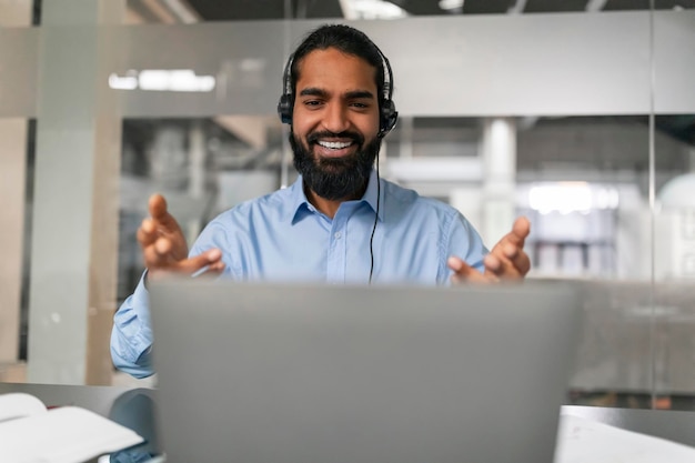 Smiling man gesturing in video call