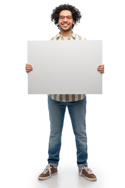 smiling man in glasses holding big white board