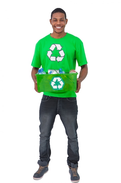 Smiling man holding box of recyclables