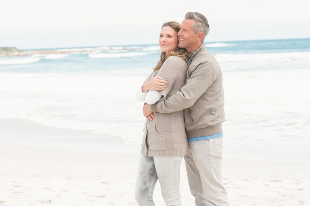 Smiling man holding his partner