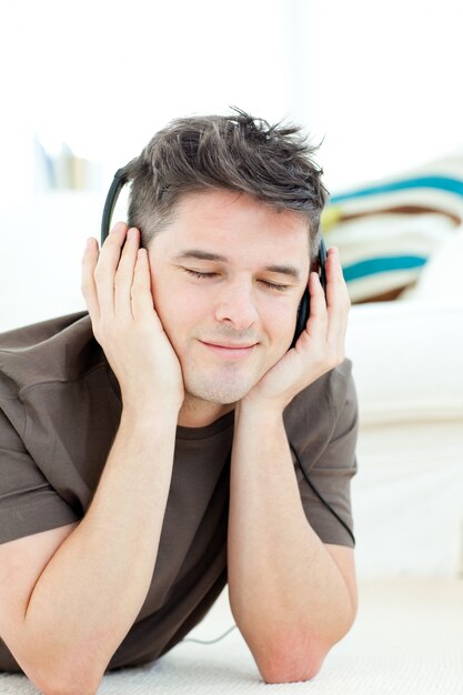 Smiling man listening the music 