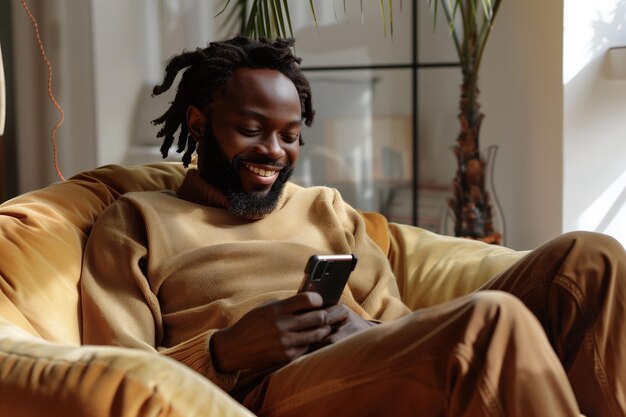 Photo smiling man relaxing on beanbag with smartphone