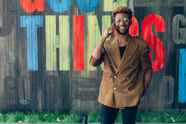 Smiling man talking on phone