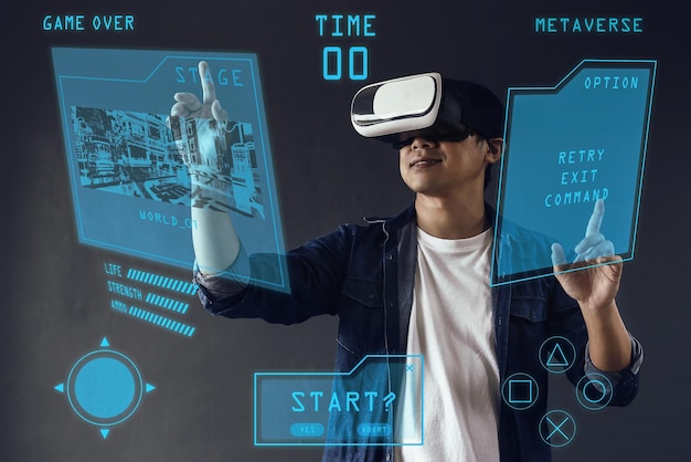 Smiling man touching 3d visual simulation using virtual reality goggle on dark grey background Futu