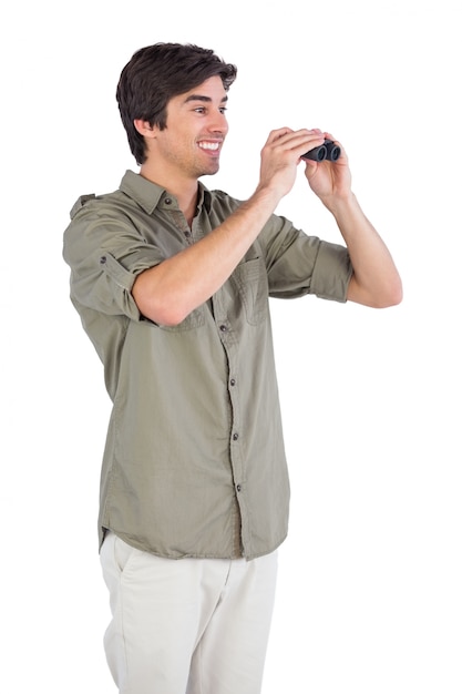 Smiling man using binoculars