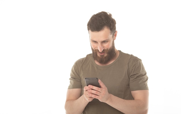 Smiling man with beard holding mobile phone