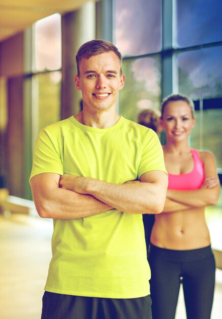 smiling man and woman in gym