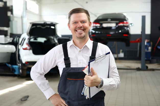 Smiling man worker repair car service portrait Training profession automotive mechanic concept