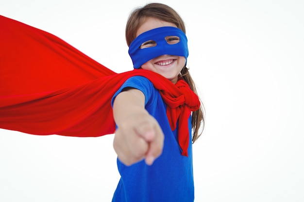 Smiling masked girl pretending to be superhero