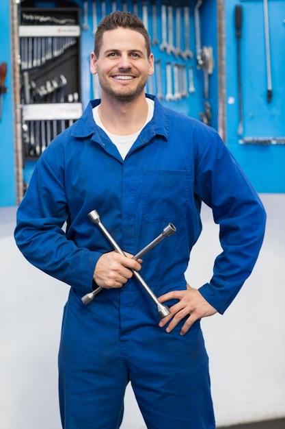 Smiling mechanic looking at camera