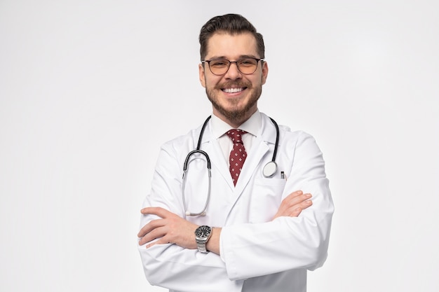 Photo smiling medical doctor. isolated over white wall