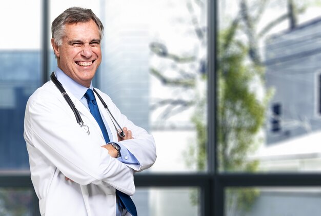 Smiling medical doctor with stethoscope.