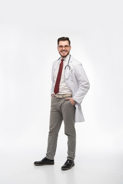 Smiling medical worker in white coat and tie