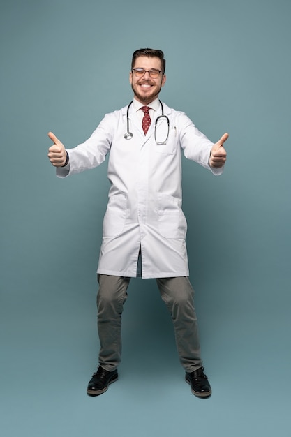 Smiling medical worker in white coat and tie