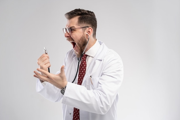 Smiling medical worker in white coat and tie