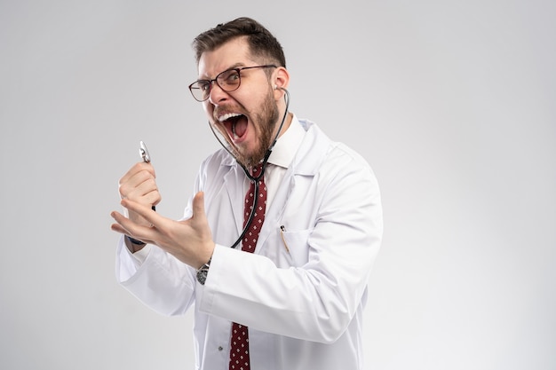 Smiling medical worker in white coat and tie