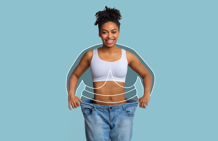Photo smiling millennial slim african american female in big jeans enjoying weight loss result with fat abstract body around