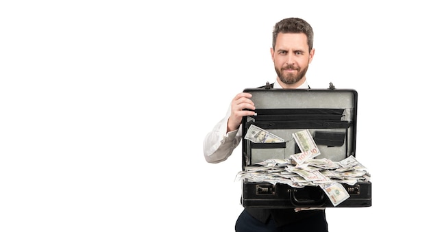 Smiling millionaire holding case full of dollar cash isolated on white background, copy space, success.