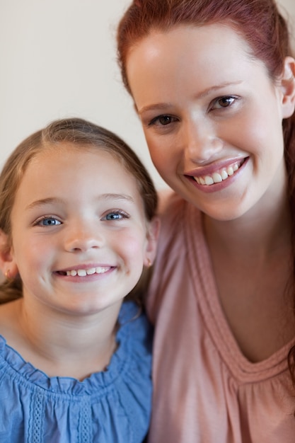 Smiling mother and daughter