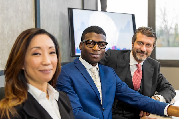 Smiling multiracial businesspeople in office