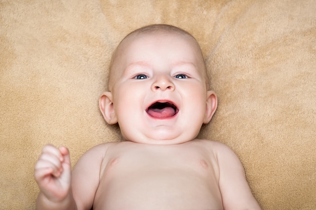 Smiling naked baby