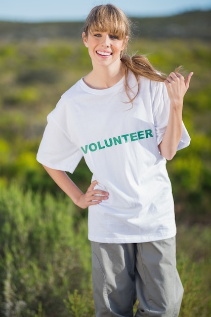 Smiling natural blonde wearing a volunteering t shirt