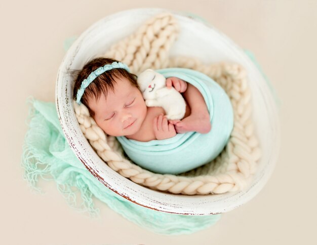 Smiling newborn sleeping