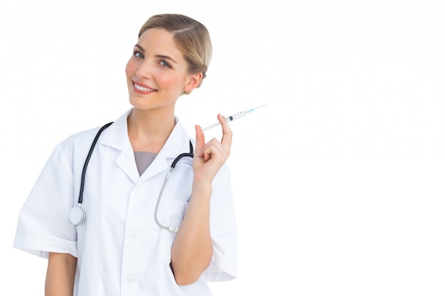 Smiling nurse preparing syringe