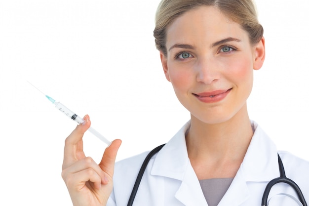 Smiling nurse with syringe