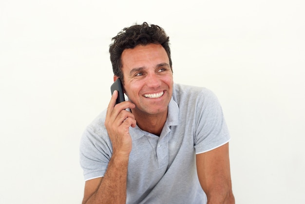 Smiling older man talking on mobile phone