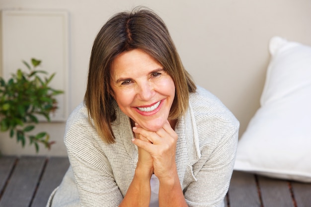 Smiling older woman sitting outside