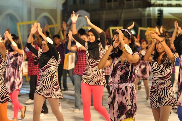 Smiling people walking on street during carnival