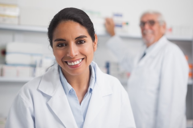 Smiling pharmacist looking at camera