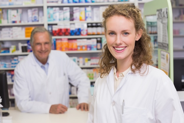 Smiling pharmacists looking at camera 